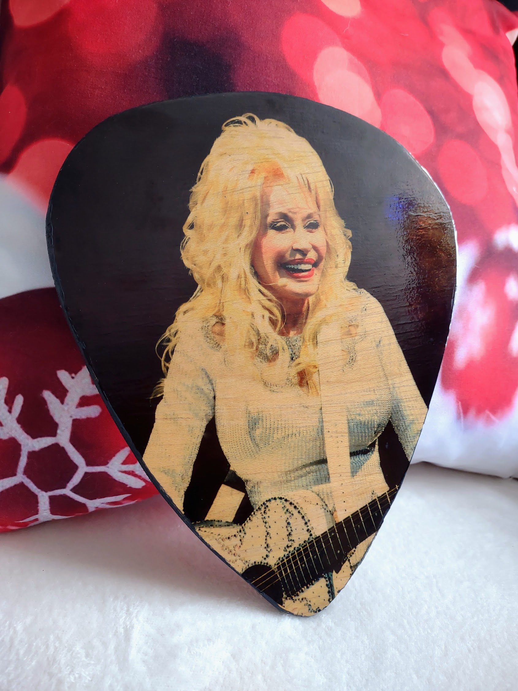 Dolly Parton on custom oversized guitar pick