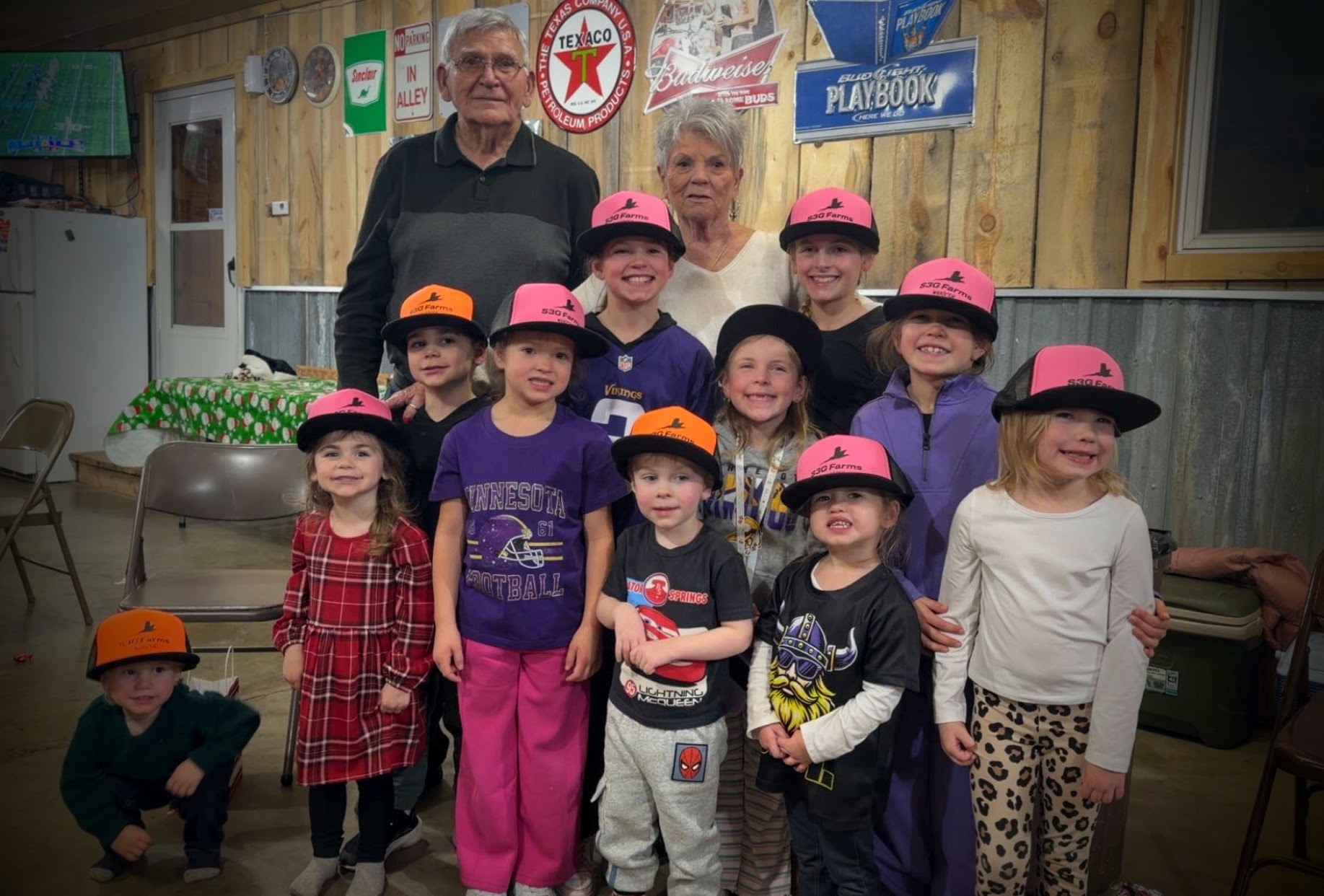 family with custom neon caps